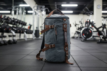 Gray backpack with brown straps in a gym