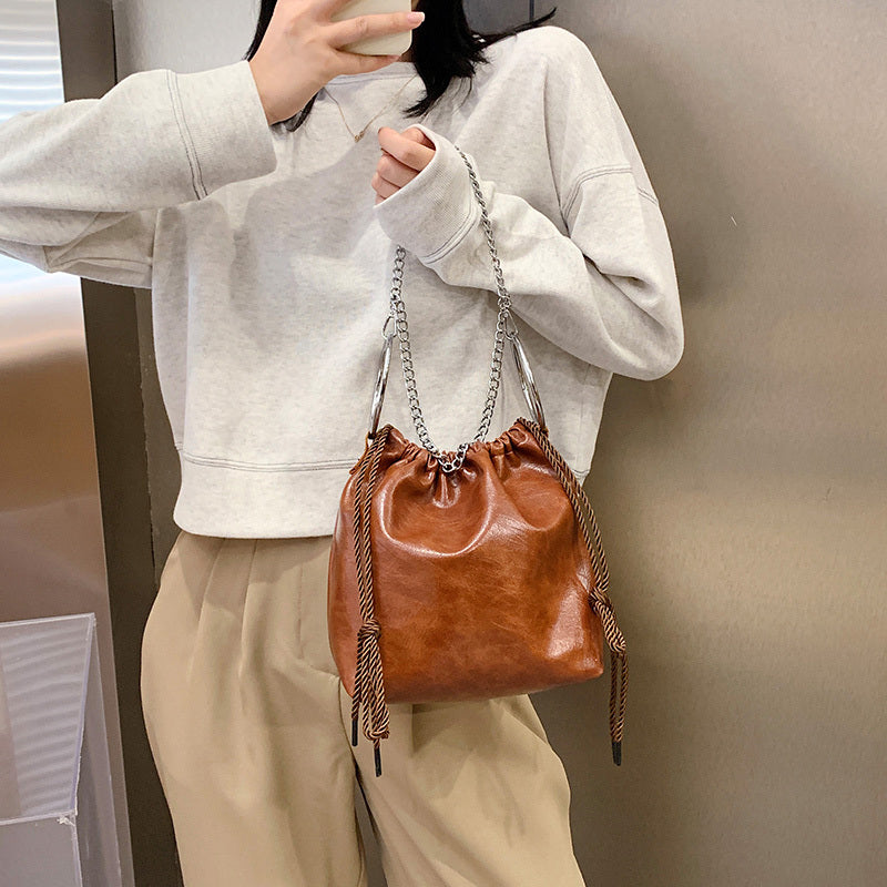 Pleated portable shoulder bag