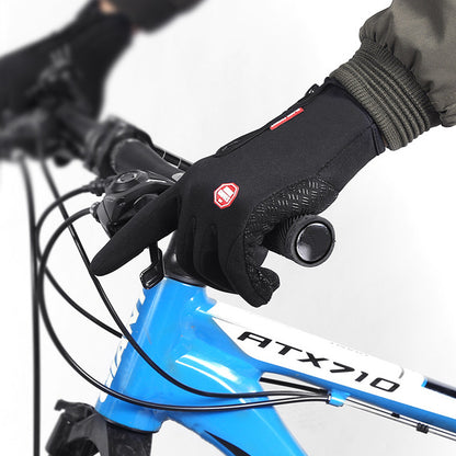 Close-up of a gloved hand on a bicycle handlebar with a blue bike frame labeled 'ATX710'.