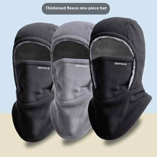 Three balaclavas in black, gray, and black on a light blue and beige background.