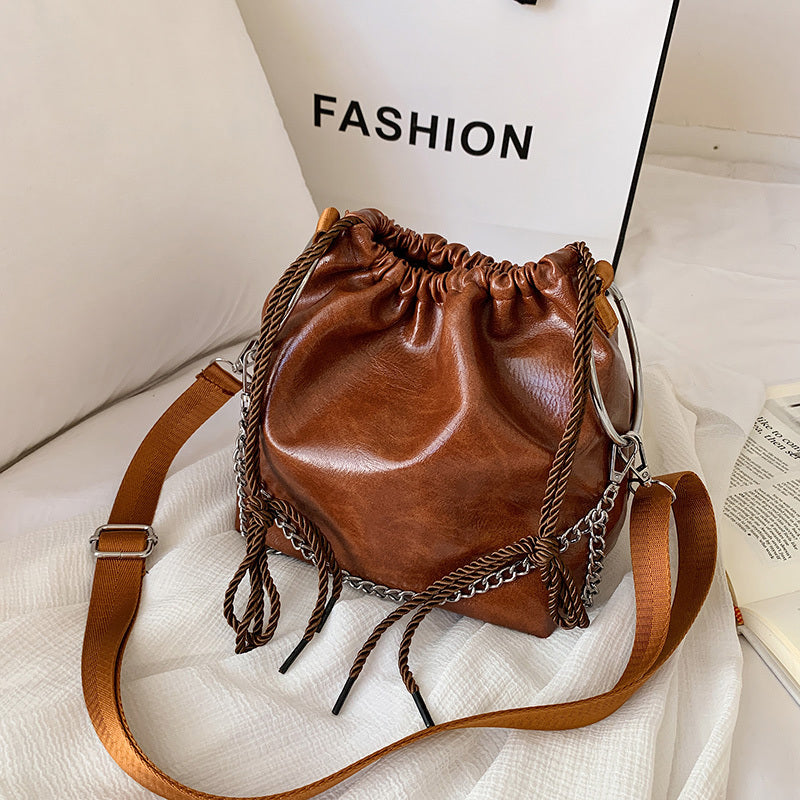 Pleated portable shoulder bag