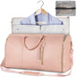 Pink travel bag with a hanger and garment inside, on a white background